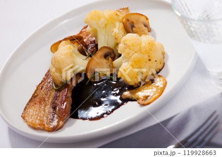 Cauliflower with bacon and mushrooms 119928663