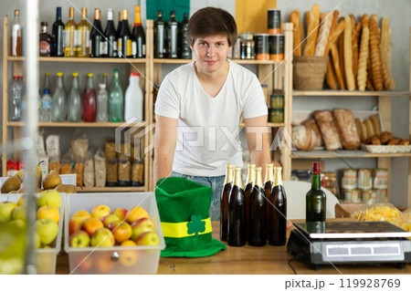 Seller in a leprechaun hat in a supermarket Seller in a leprechaun hat in a supermarket 119928769