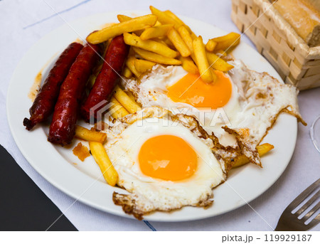 Huevos con chistorra. Scrambled eggs with sausage and potatoes. Spanish cuisine Huevos con chistorra. Scrambled eggs with sausage and potatoes. Spanish cuisine 119929187