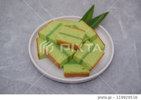 pandan cake on a white plate. Selective focus. 119929516