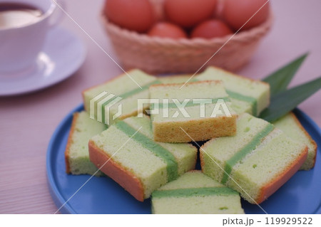 pandan cake on a blue plate. Selective focus. pandan cake on a blue plate. Selective focus. 119929522