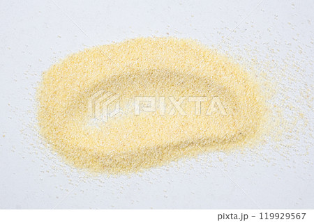 Smear of uncooked raw durum wheat semolina top view. 119929567