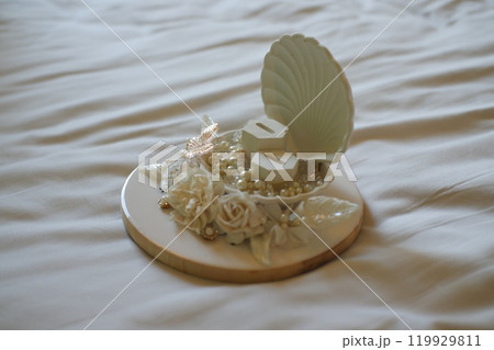 Elegant Wedding Ring Holder with Floral Decorations 119929811