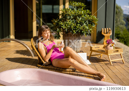 Relaxation with Sunscreen on a Wooden Deck Relaxation with Sunscreen on a Wooden Deck 119930613