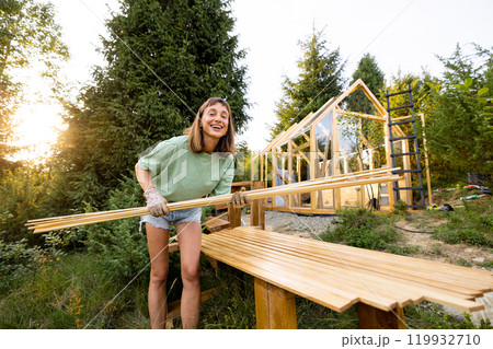 Female Carpenter with Wooden Planks 119932710