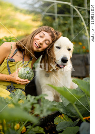 Woman with her dog in eco-friendly garden Woman with her dog in eco-friendly garden 119932814