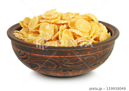 Cornflakes in ceramic bowl isolated on white background. Cornflakes in ceramic bowl isolated on white background. 119938049