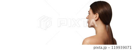 Banner. Rear view photo of well-groomed young girl with long brunette hair against white background with negative space to insert text. 119939071