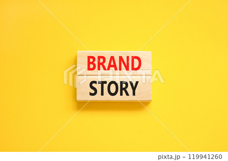 Brand story branding symbol. Concept words Brand story on beautiful wooden blocks. Beautiful yellow background. Business brand story branding concept. Copy space. Brand story branding symbol. Concept words Brand story on beautiful wooden blocks. Beautiful yellow background. Business brand story branding concept. Copy space. 119941260