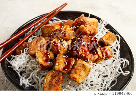 fried eggplant, with funchosa noodles, with teriyaki sauce and sesame seeds, homemade, no people 119942460