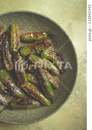 fried padron pepper, in a frying pan, with olive oil, and sea salt, homemade, no people. 119942495