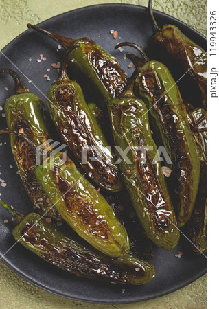fried padron pepper, in a frying pan, with olive oil, and sea salt, homemade, no people. fried padron pepper, in a frying pan, with olive oil, and sea salt, homemade, no people. 119943326
