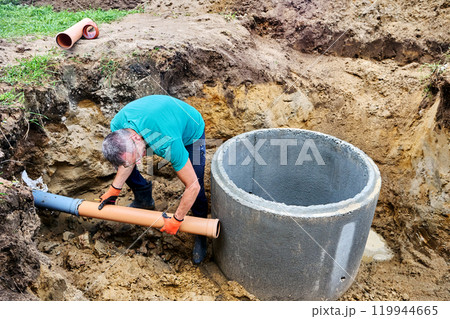 Outlet of sewer pipe from first septic tank compartment for entry into biological compartment. Outlet of sewer pipe from first septic tank compartment for entry into biological compartment. 119944665