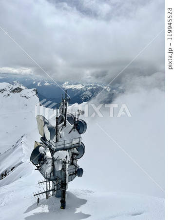 Remote Communication Tower Amid Snowy Bavarian Mountain Peaks on Zugspitze, Germany 119945528