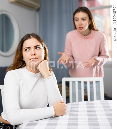 Girlfriend or sister yelling at girl during family quarrel 119948794