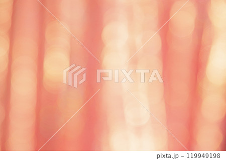 Defocused peach glitter background with sparkles. Defocus light is yellow and orange. Defocused peach glitter background with sparkles. Defocus light is yellow and orange. 119949198