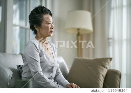 portrait of a sad asian elderly woman portrait of a sad asian elderly woman 119949364