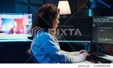 Teleworking system administrator futureproofing company network from downtimes and unexpected failures. Remote IT employee typing on keyboard, increasing data security, camera A Teleworking system administrator futureproofing company network from downtimes and unexpected failures. Remote IT employee typing on keyboard, increasing data security, camera A 119949449