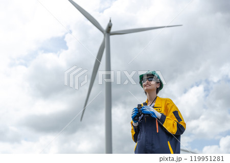 Renewable energy systems concept, engineer female working survey wind turbine for alternative energy, Technology protect environment reduce global warming problems. Renewable energy systems concept, engineer female working survey wind turbine for alternative energy, Technology protect environment reduce global warming problems. 119951281