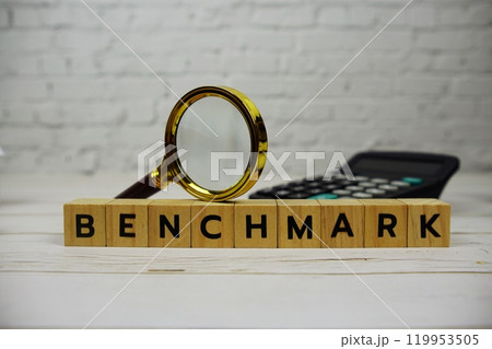 Benchmark with wooden blocks alphabet letters and magnifying glass, calculator Benchmark with wooden blocks alphabet letters and magnifying glass, calculator 119953505