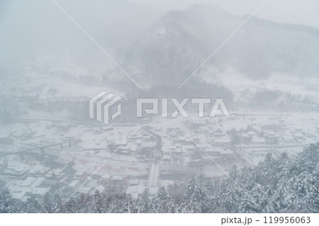 view of village with snow in winter from mountain viewpoint of Yamadera temple, the popular name for the Buddhist temple of Risshakuji located in Yamagata City, in Yamagata Prefecture, Tohuku, Japan view of village with snow in winter from mountain viewpoint of Yamadera temple, the popular name for the Buddhist temple of Risshakuji located in Yamagata City, in Yamagata Prefecture, Tohuku, Japan 119956063