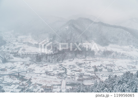 view of village with snow in winter from mountain viewpoint of Yamadera temple, the popular name for the Buddhist temple of Risshakuji located in Yamagata City, in Yamagata Prefecture, Tohuku, Japan 119956065