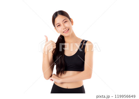 Portrait of beautiful young asian woman in sportswear gesture thumbs up with success isolated. 119956649
