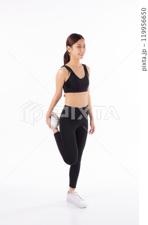 Portrait young asian woman in sportswear stretching muscle leg for health isolated. 119956650
