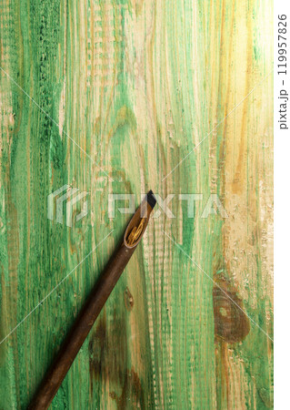 Calligraphy reeds covered ink on wooden background Calligraphy reeds covered ink on wooden background 119957826