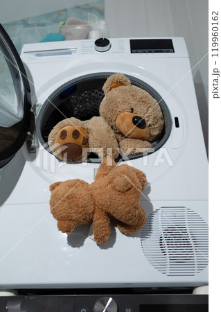 Teddy Bears Being Washed in a Washing Machine Makes for a Fun and Adorable Scene 119960162