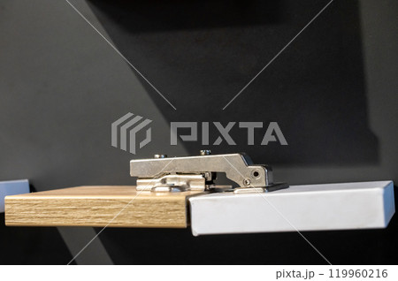 Modern Cabinet Hinge on Wooden Board Modern Cabinet Hinge on Wooden Board 119960216