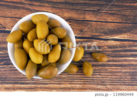 Green olives in bowl 119960449