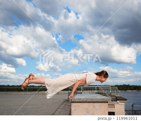 Girl in the city did a horizontal handstand Girl in the city did a horizontal handstand 119961011