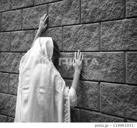Praying person at the wall Praying person at the wall 119961031