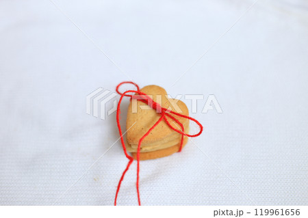 heart-shaped cookies beautifully arranged in charming holiday packaging, making them the perfect gift for Valentine's Day 119961656