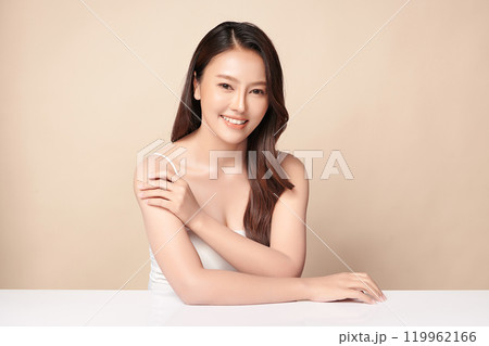 Beautiful young asian woman with clean fresh skin on beige background, Face care, Facial treatment, Cosmetology, beauty and spa, Asian women portrait. 119962166