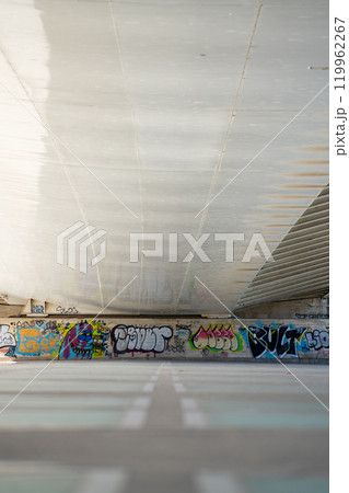 the wall is covered with graffiti painting 119962267