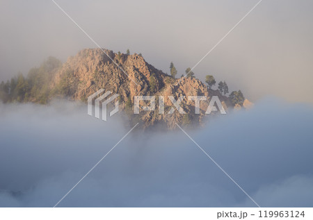 Cliff in a sea of clouds. 119963124