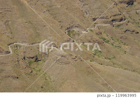 Winding road on a hillside. Winding road on a hillside. 119963995