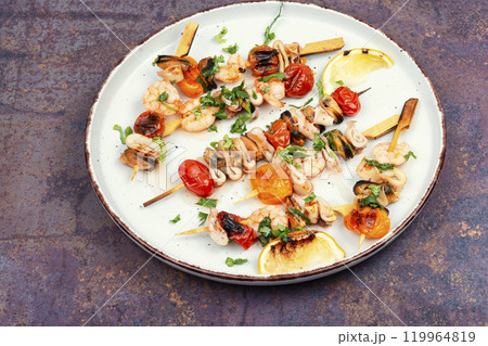 Grilled seafood on skewers. Grilled seafood on skewers. 119964819