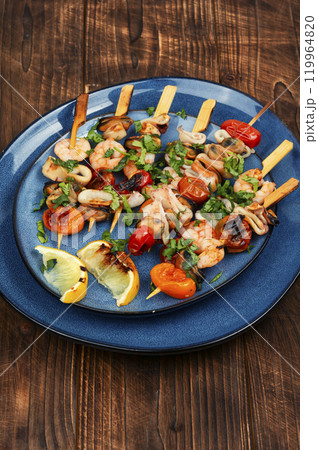 Appetizing seafood kebabs. Appetizing seafood kebabs. 119964820