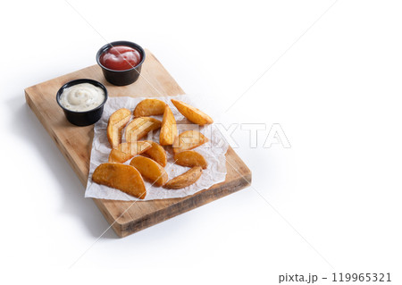 Fried potato wedges with sauces isolated on white background. Fried potato wedges with sauces isolated on white background. 119965321