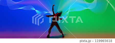 Creative design. Dynamic image of young woman in casual clothes dancing hip hop on gradient blue green background with abstract neon flow Creative design. Dynamic image of young woman in casual clothes dancing hip hop on gradient blue green background with abstract neon flow 119965618