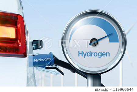 Close up of fuel cell car with connected hydrogen fueling nozzle. Wind turbines in the background 119966644