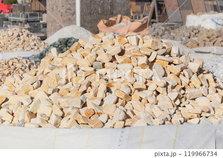 Quartzite decorative tiles are sold in construction market. Natural stone material for decoration and construction. Materials pebbles. 119966734