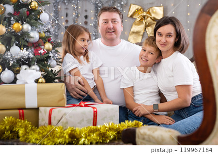 Portrait of parents with son and daughter during christmas celebration at home 119967184
