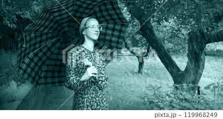Young girl with an umbrella 119968249