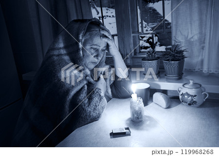 Woman with candles. Power outage in Kyiv 119968268