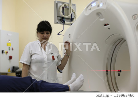 Main medical hospital.An unknown woman is made magneto-resonant therapy.Medical examination of the body Main medical hospital.An unknown woman is made magneto-resonant therapy.Medical examination of the body 119968460