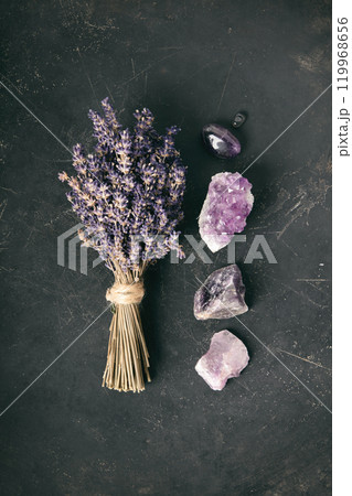 Lavender Bundle and Amethyst Crystals on Dark Surface 119968656
